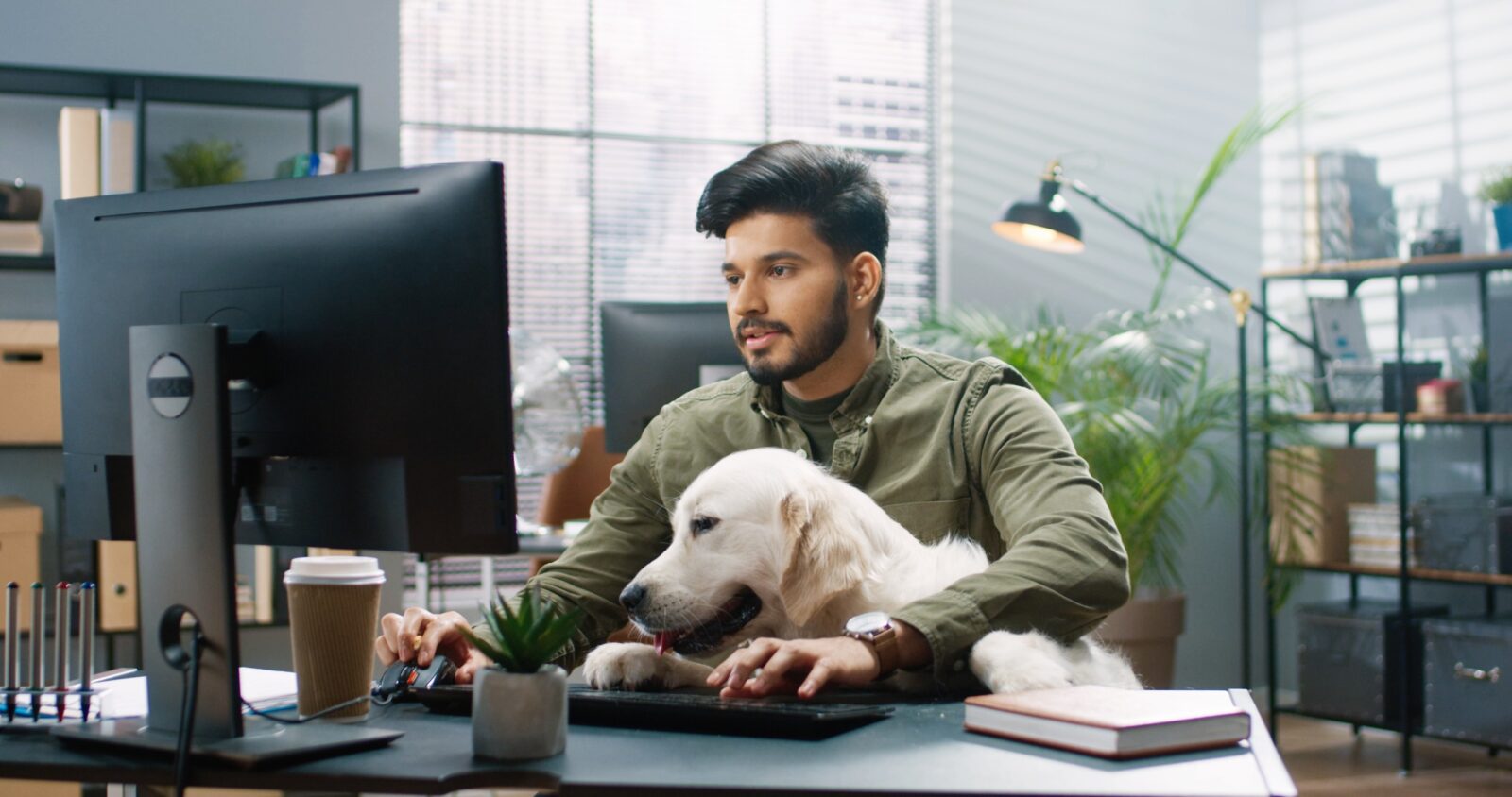 A professional working from home at a desk, part of a hybrid team